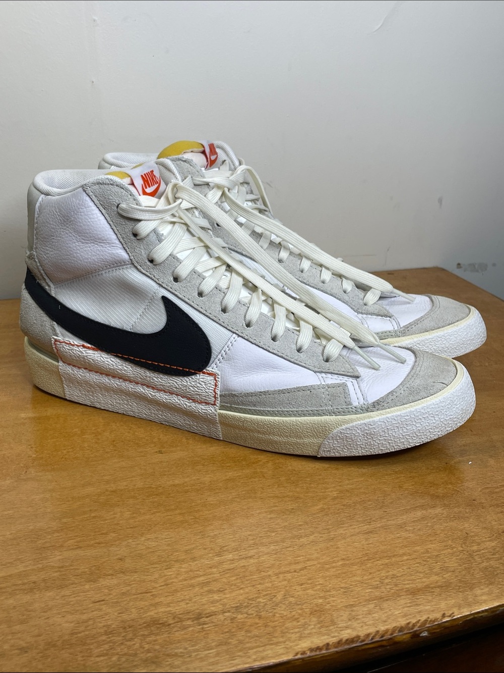 Nike Men’s White High-Top Sneakers w/ Black Swoosh and Orange Accent. Size 12.5